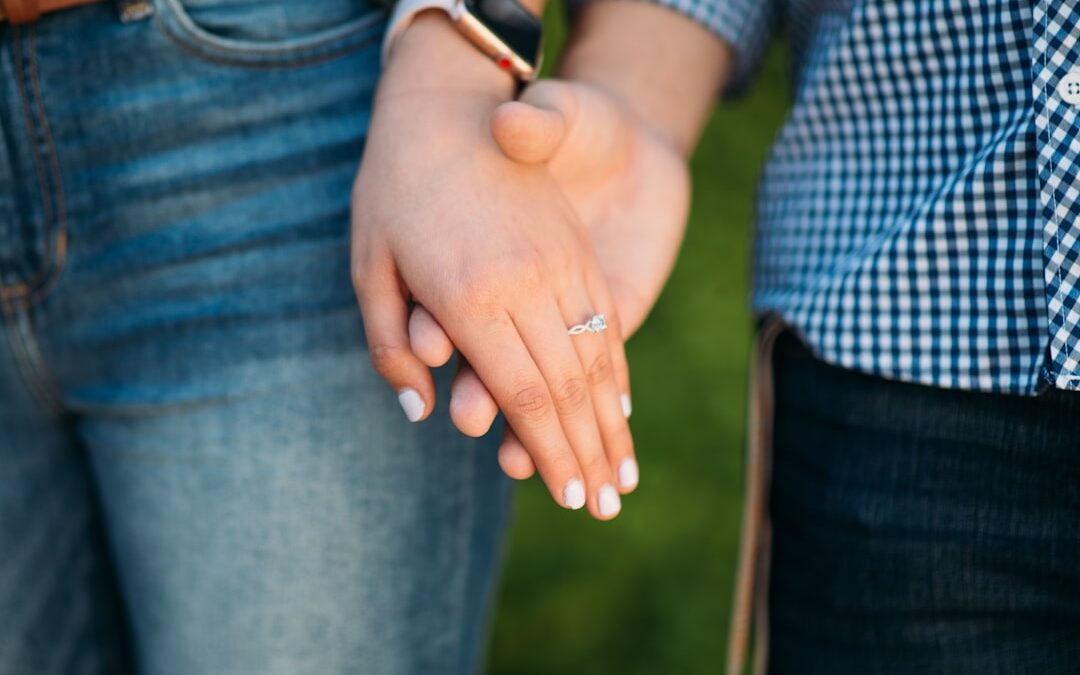 Elderly man playing a cognitive stimulation game on a tablet device, smiling and enjoying the activity.