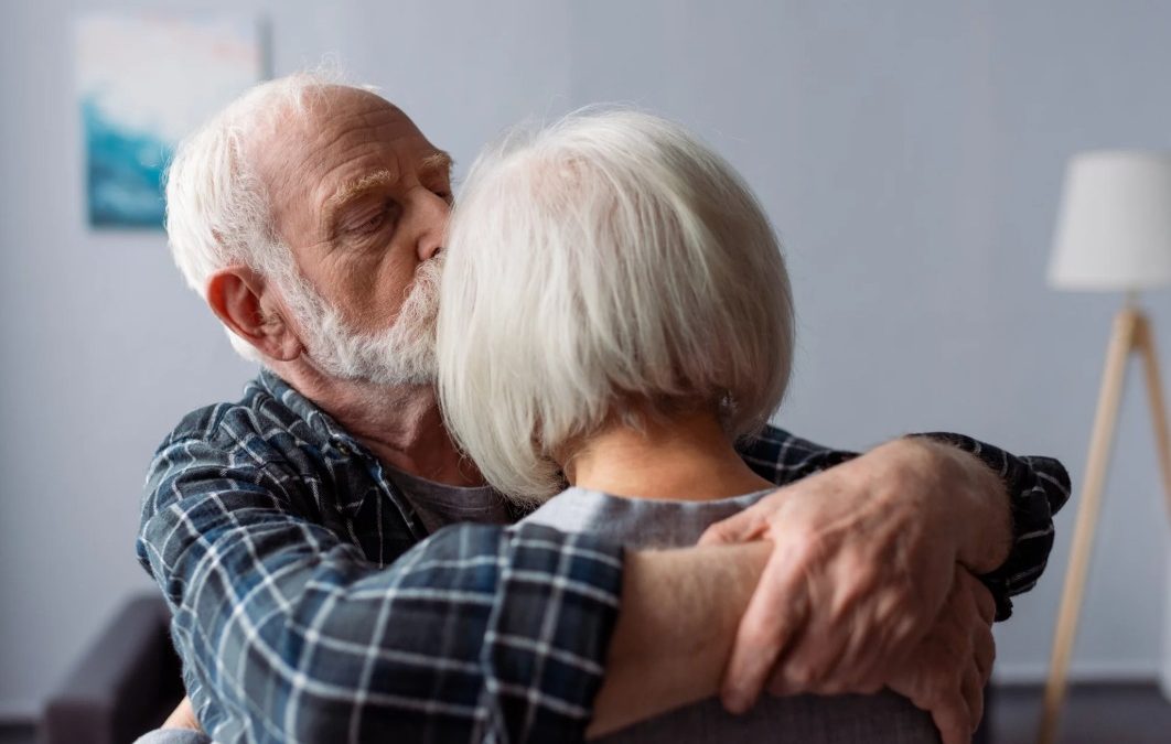 Elderly person engaging in cognitive stimulation activities to improve memory and brain health