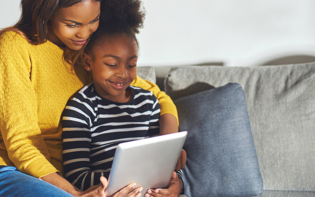 Image of a child using a tablet for therapeutic purposes, such as cognitive stimulation or educational activities.